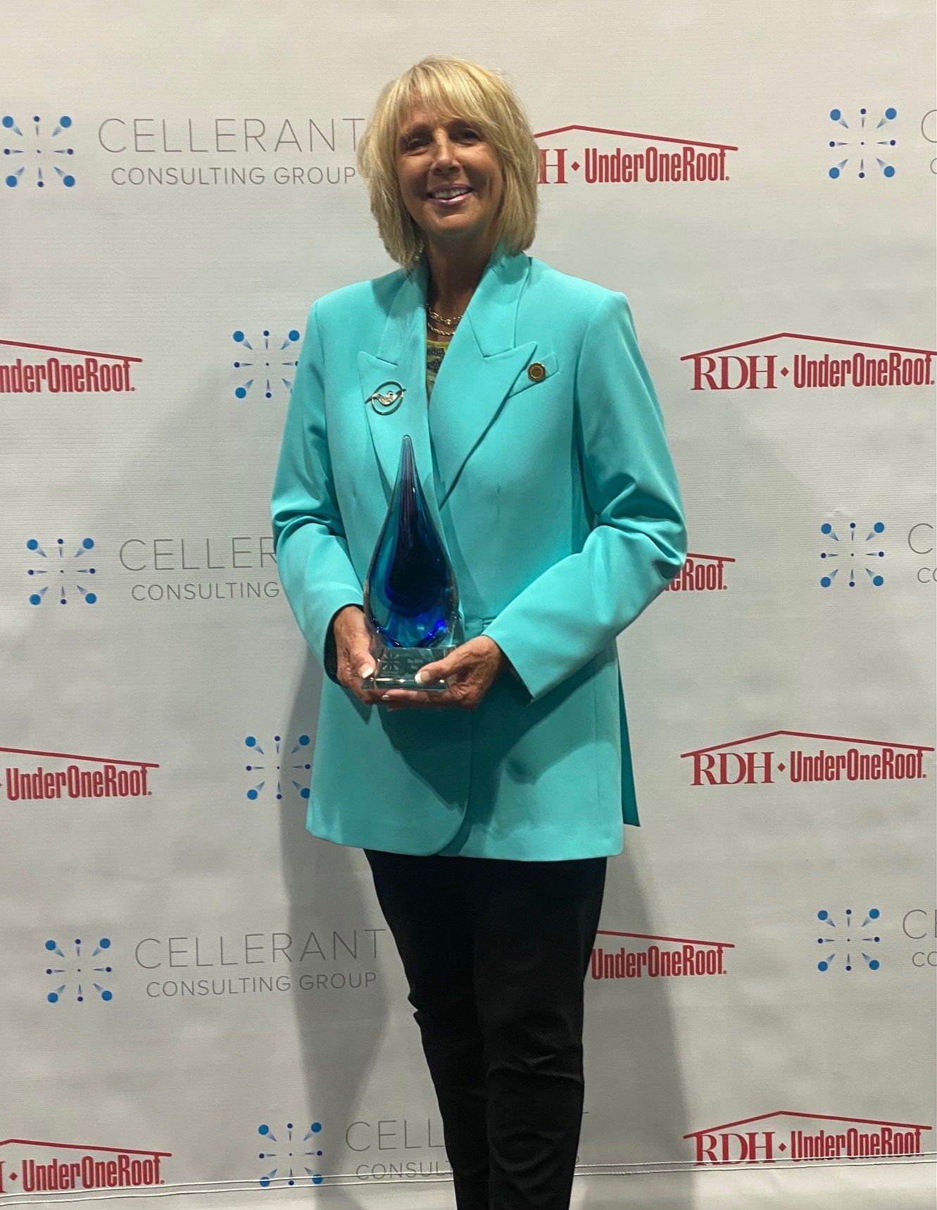 Laura,VP of Nu-bird with award for best of class evacuation mirror system for dental hygiene. 