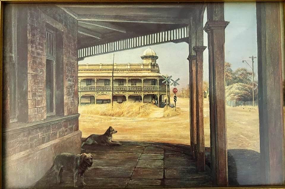 Painting of a porch with two dogs, overlooking a dusty road and a historic building.