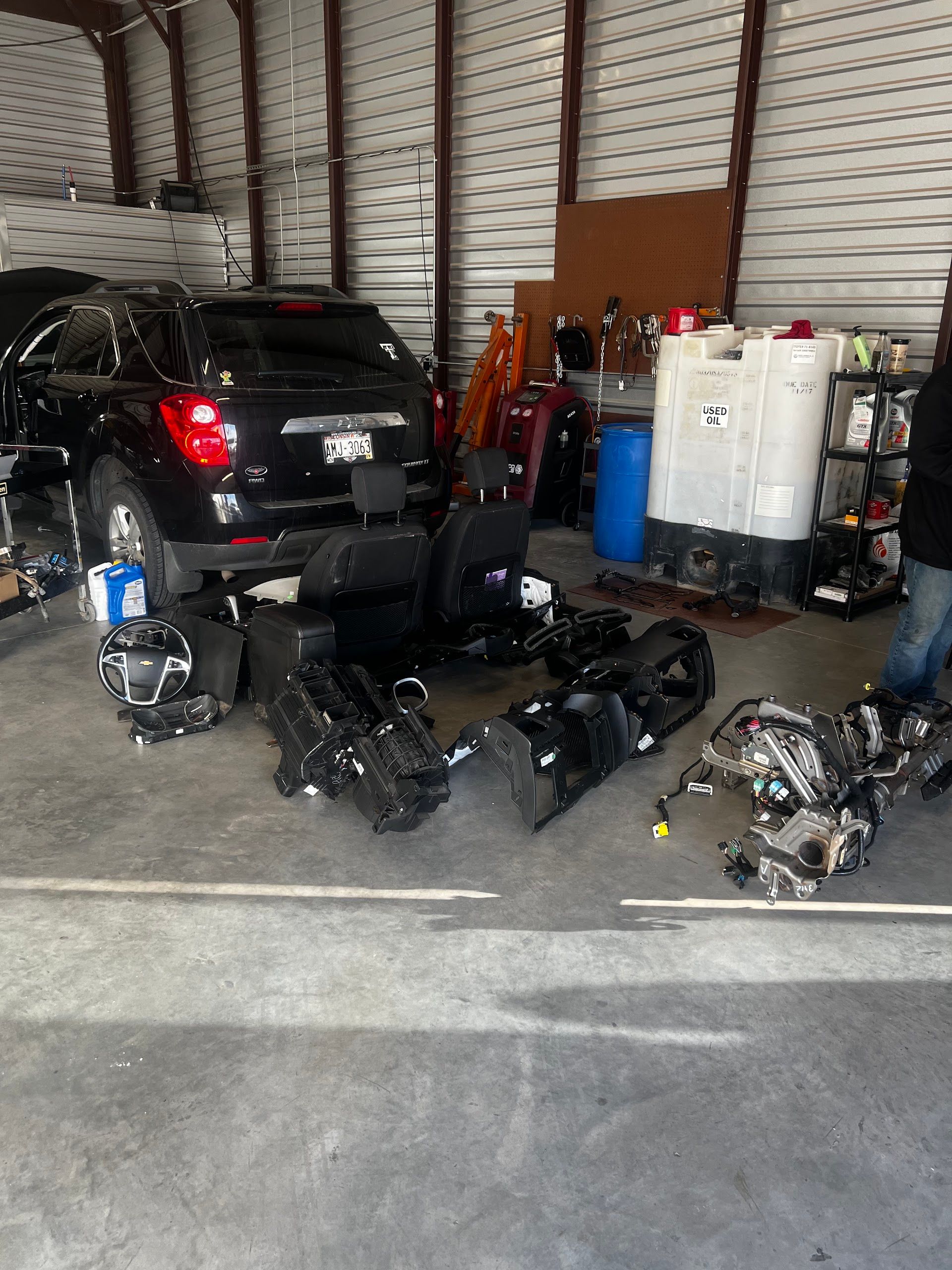 Black SUV With Removed Automotive Parts Inside Repair Shop | TLC Automotive
