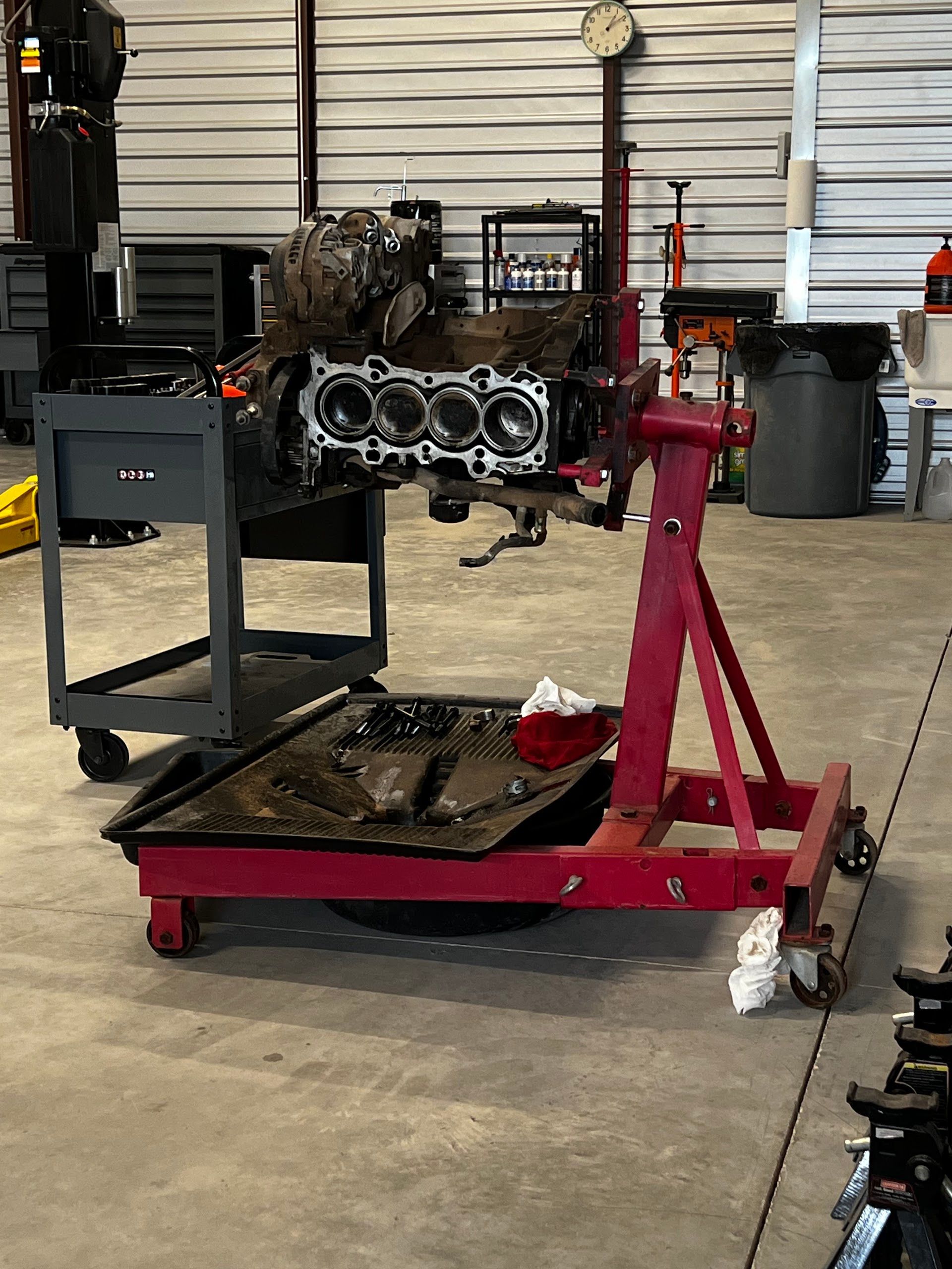 Disassembled Engine On A Stand Inside The Repair Shop | TLC Automotive