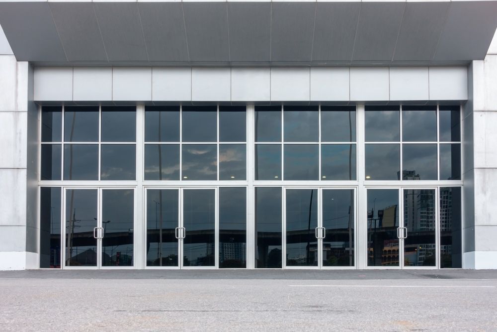 A Large Building With a Lot of Windows and Doors — Darwin Glass in Yarrawonga, NT