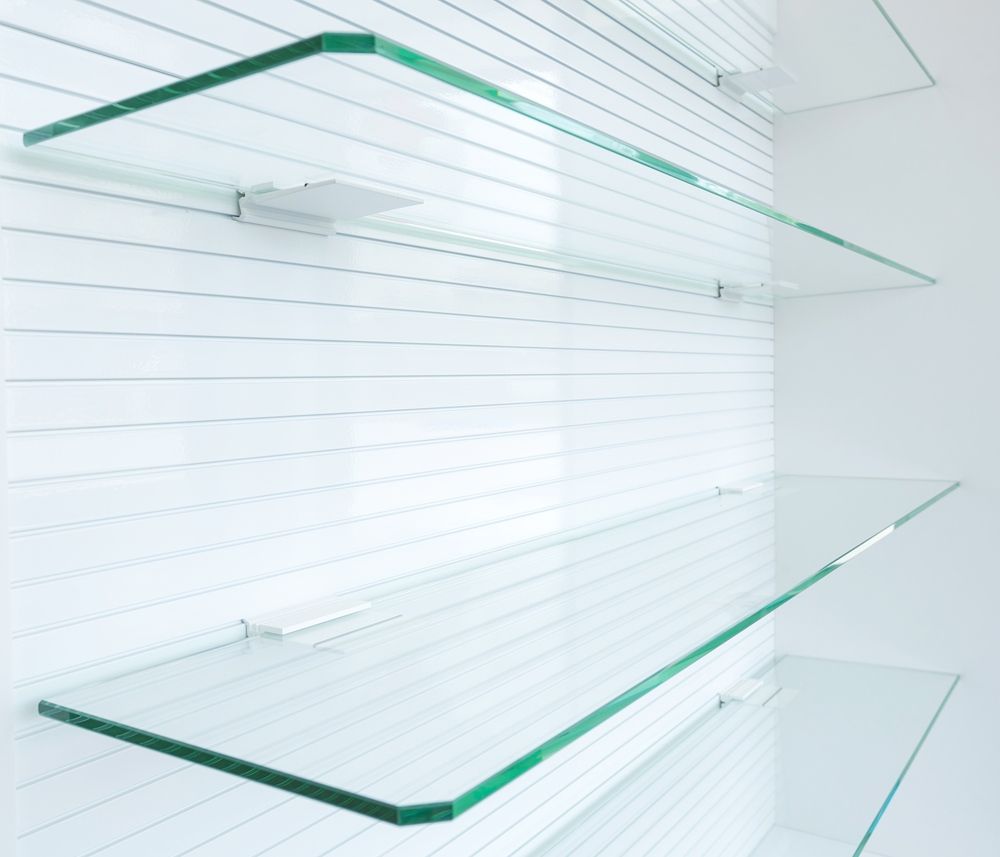 Three Empty Glass Shelves Against a White Wall — Darwin Glass in Yarrawonga, NT