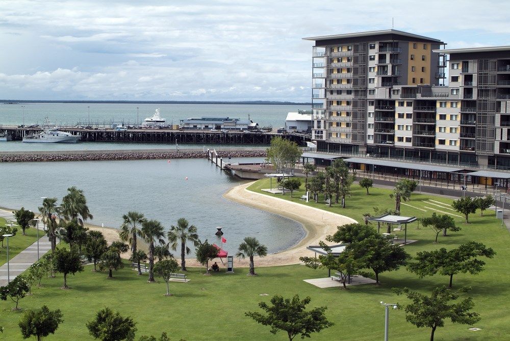 A Large Body of Water Surrounded by Buildings and Trees — Darwin Glass in Darwin, NT