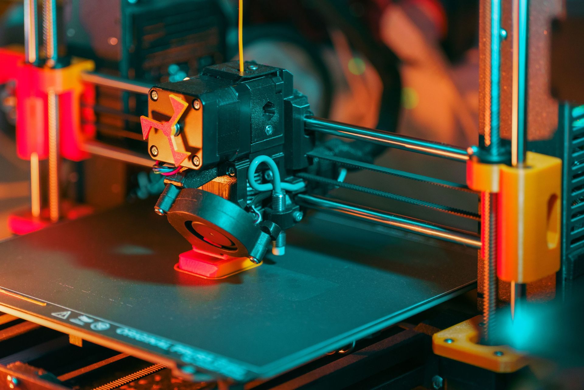 3D printer printing a prototype part on a heated print bed