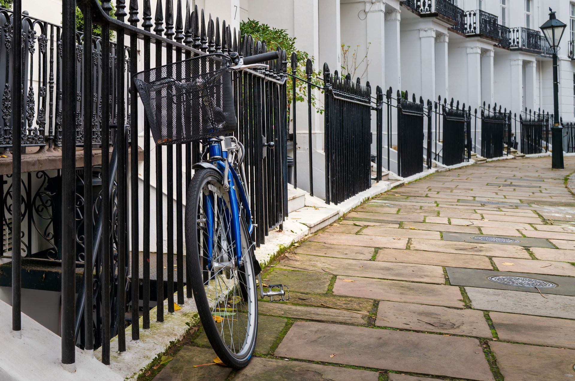 Black iron railings along a terrace of period houses