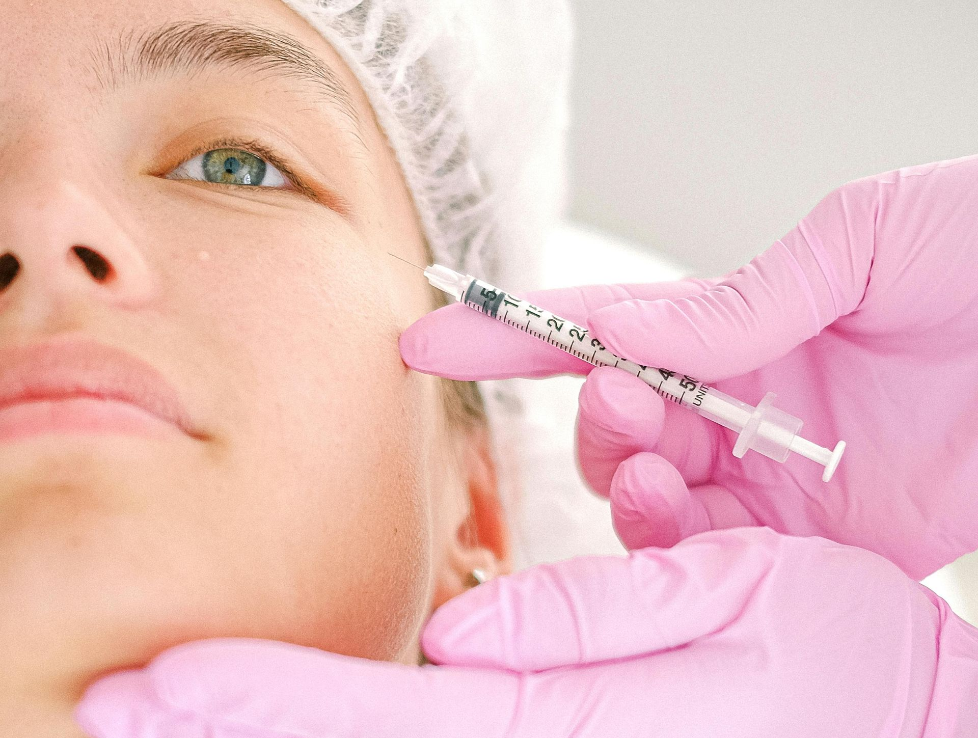 BOTOX BEING INJECTED INTO A CLIENT TO HELP WITH CROWS FEET