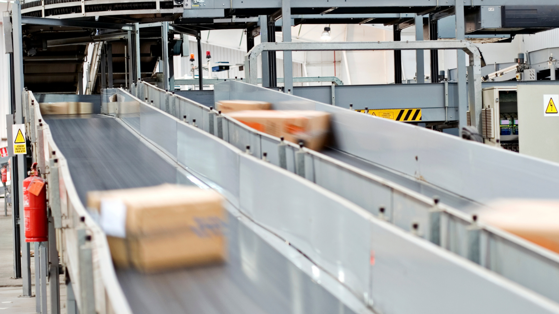 Boxes moving on a warehouse conveyor belt