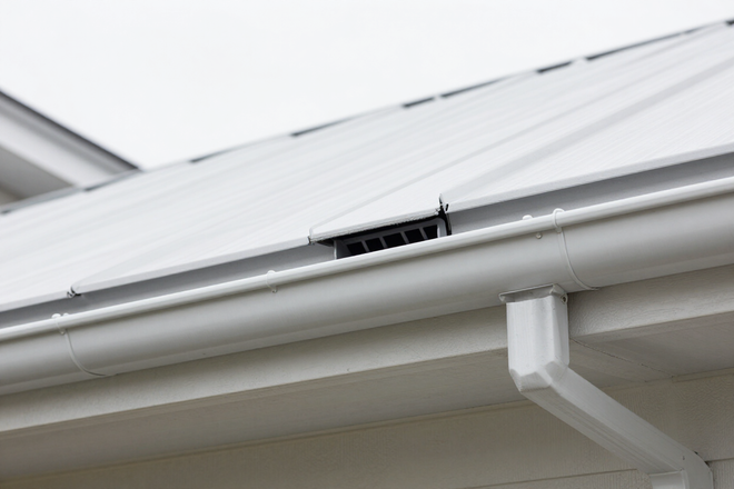 Freshly installed vented soffit panels on residential home