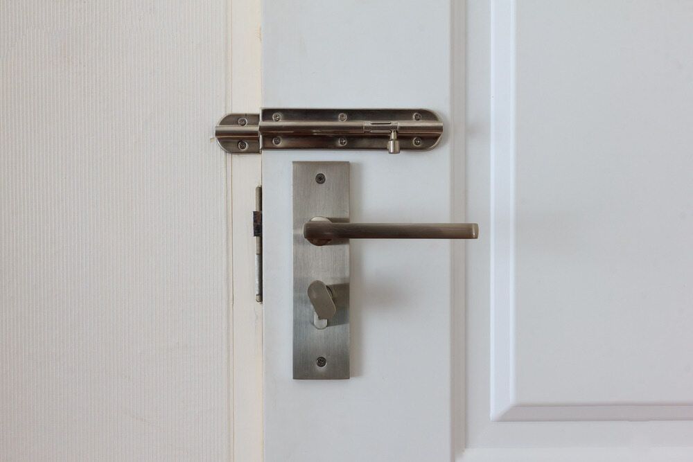 A Close Up Of A Door With A Door Handle And Latch — Grafton Locksmith Service In Grafton, NSW