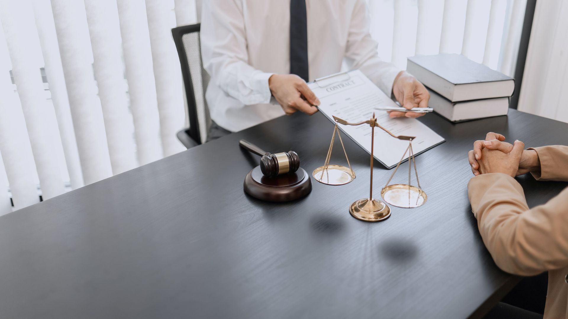 A lawyer is talking to a client. A lawyer is talking to a client.