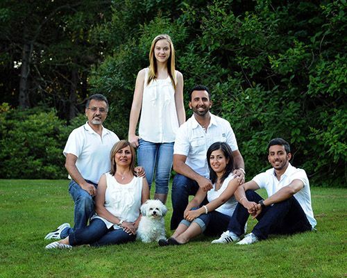 Photo of a family all wearing a white shirt
