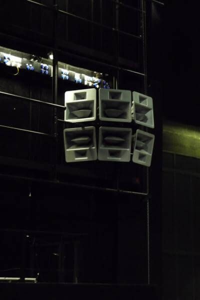 Grouped Funktion-One horn-loaded speakers suspended from stage tru