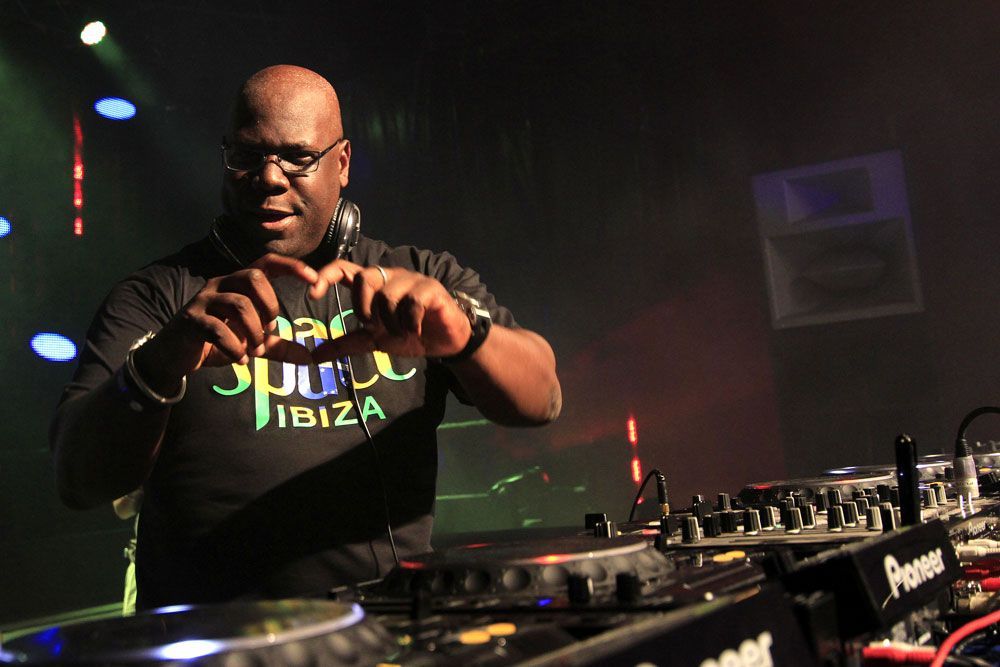 DJ wearing Space Ibiza shirt performing live with Funktion-One speakers in background.