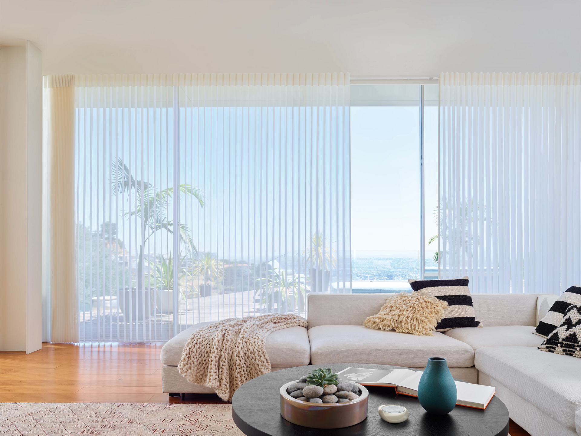 A wooden blind is hanging on a window in a room.