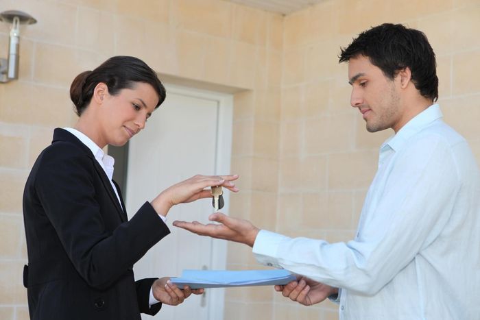 woman handling the key to the man