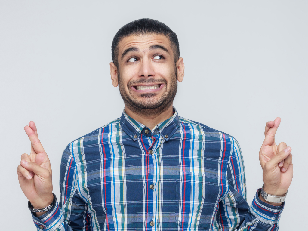 Man Crossing Fingers— St Michael, MN — EMEX Benefits Systems