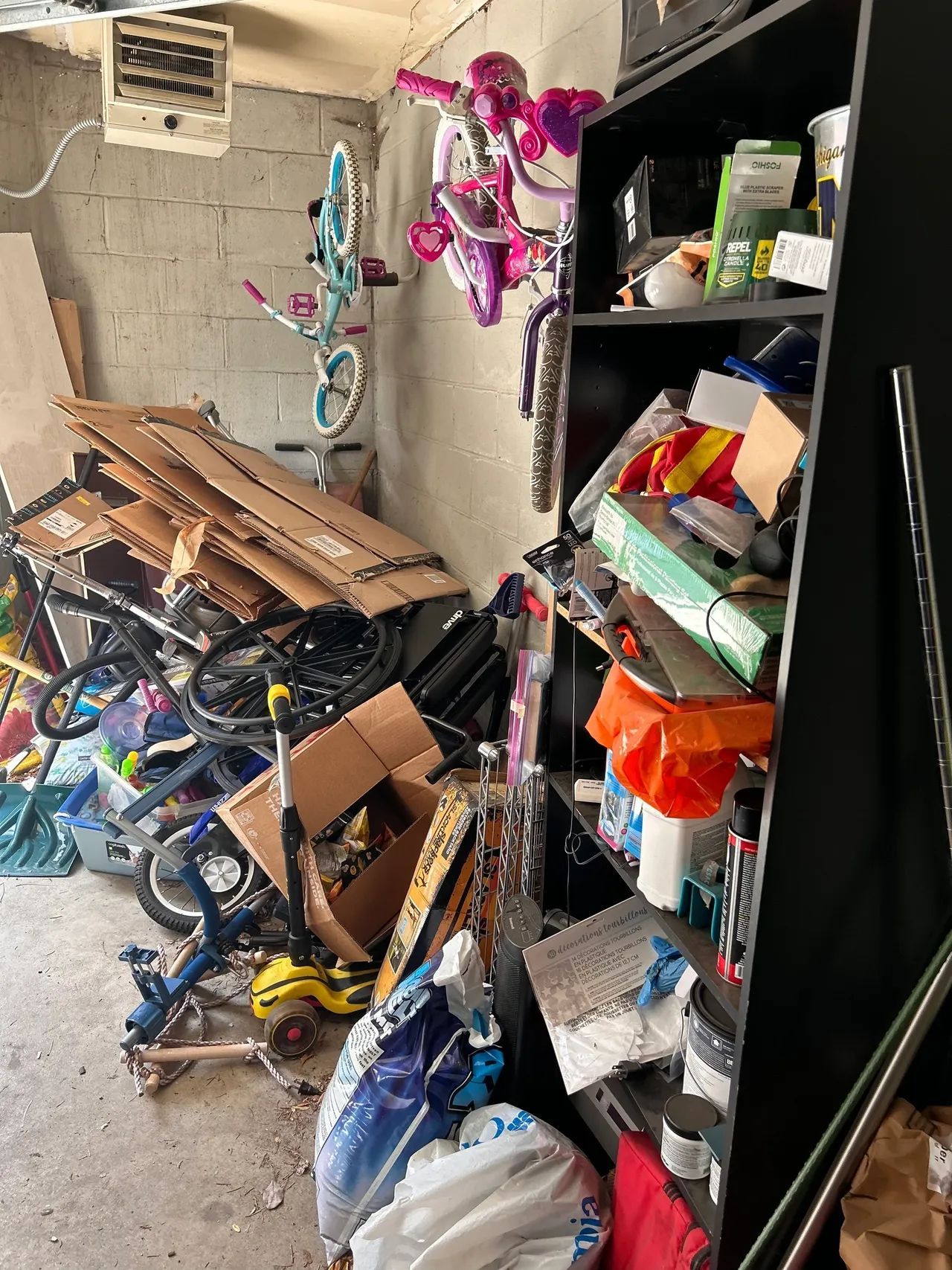 A room filled with lots of junk and bicycles.