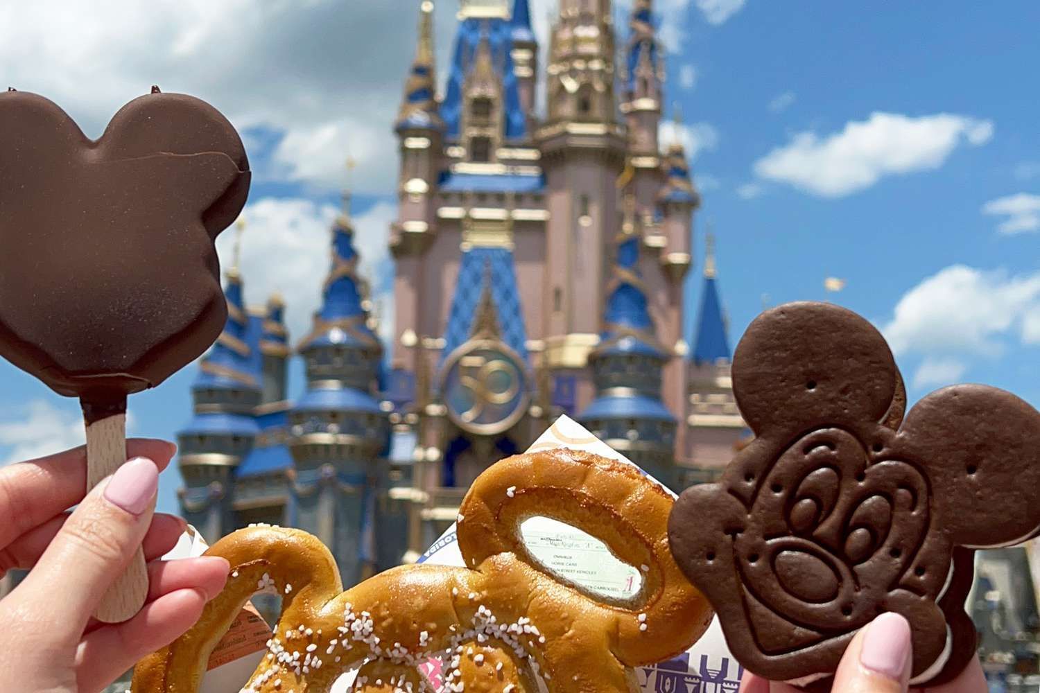Disney World Vacation Planners in Orlando with Walt Disney Castle and Mickey Mouse Snacks