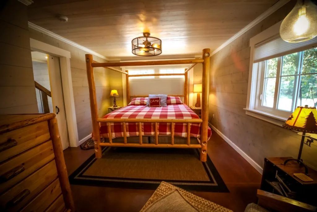 There is a four poster bed in the middle of the room.