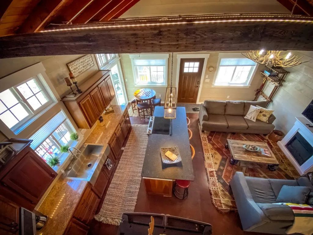 An aerial view of a living room with a couch and a fireplace
