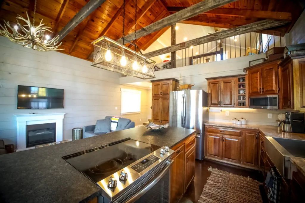 A kitchen with stainless steel appliances and wooden cabinets.