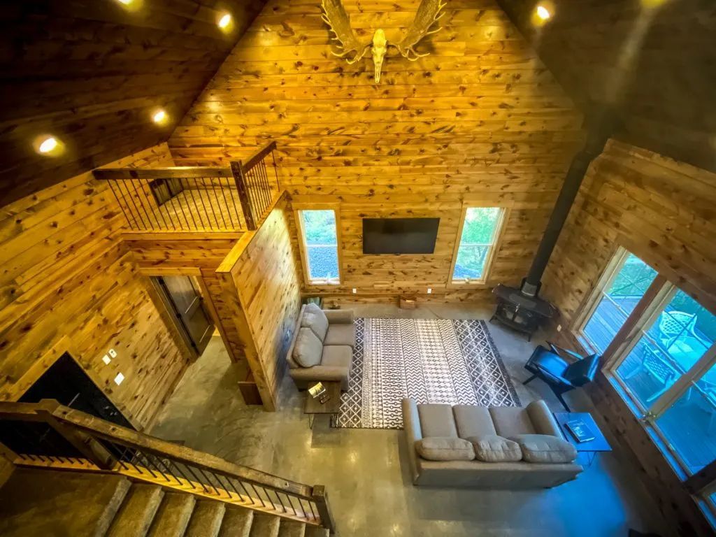 An aerial view of a living room in a log cabin.