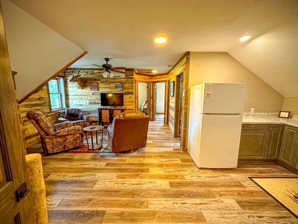 There is a refrigerator in the middle of the room.