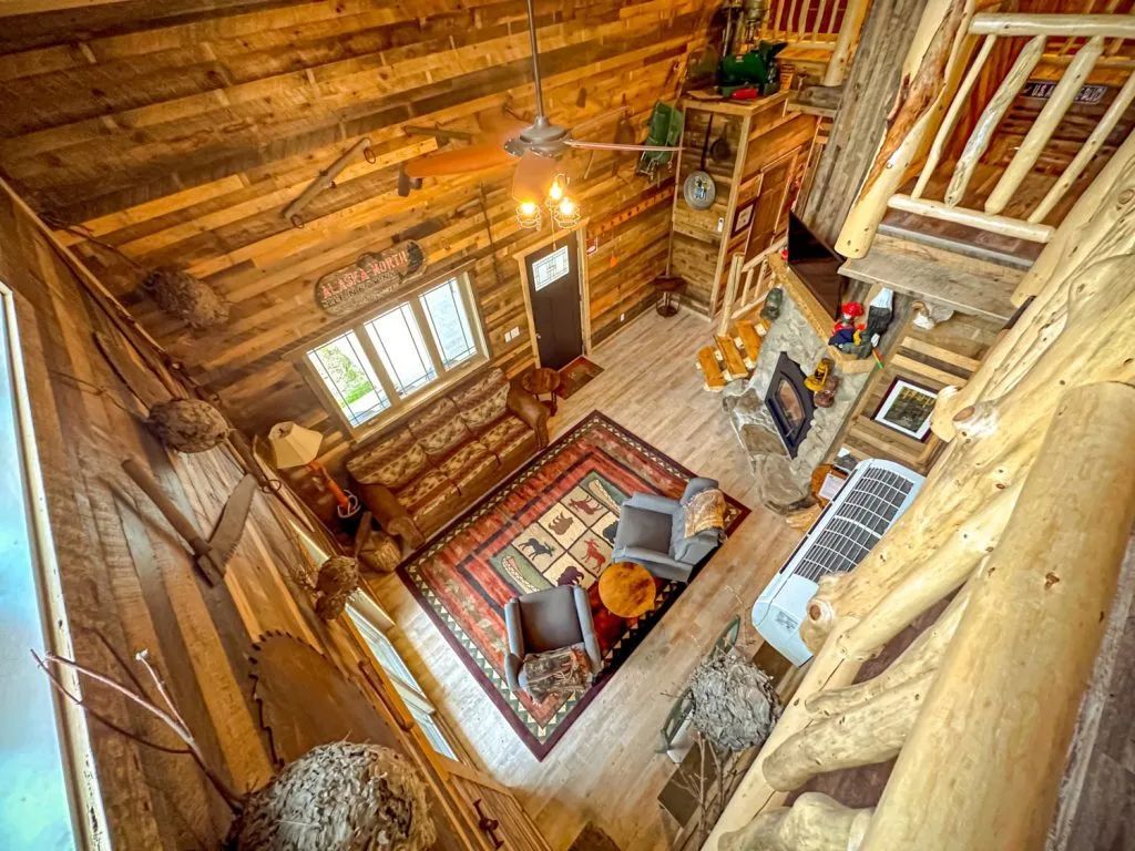 An aerial view of a living room in a log cabin.