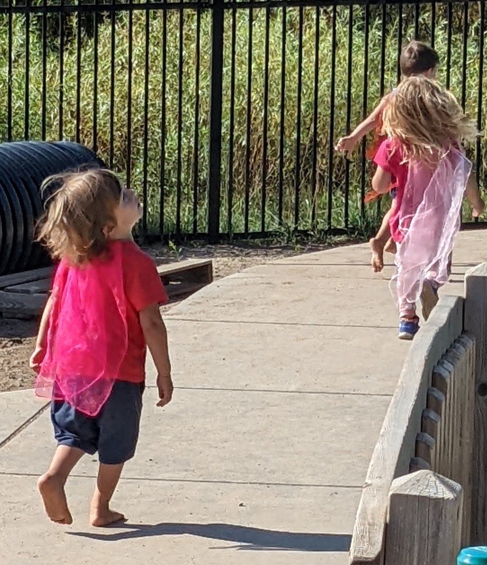 Kids in pink cape
