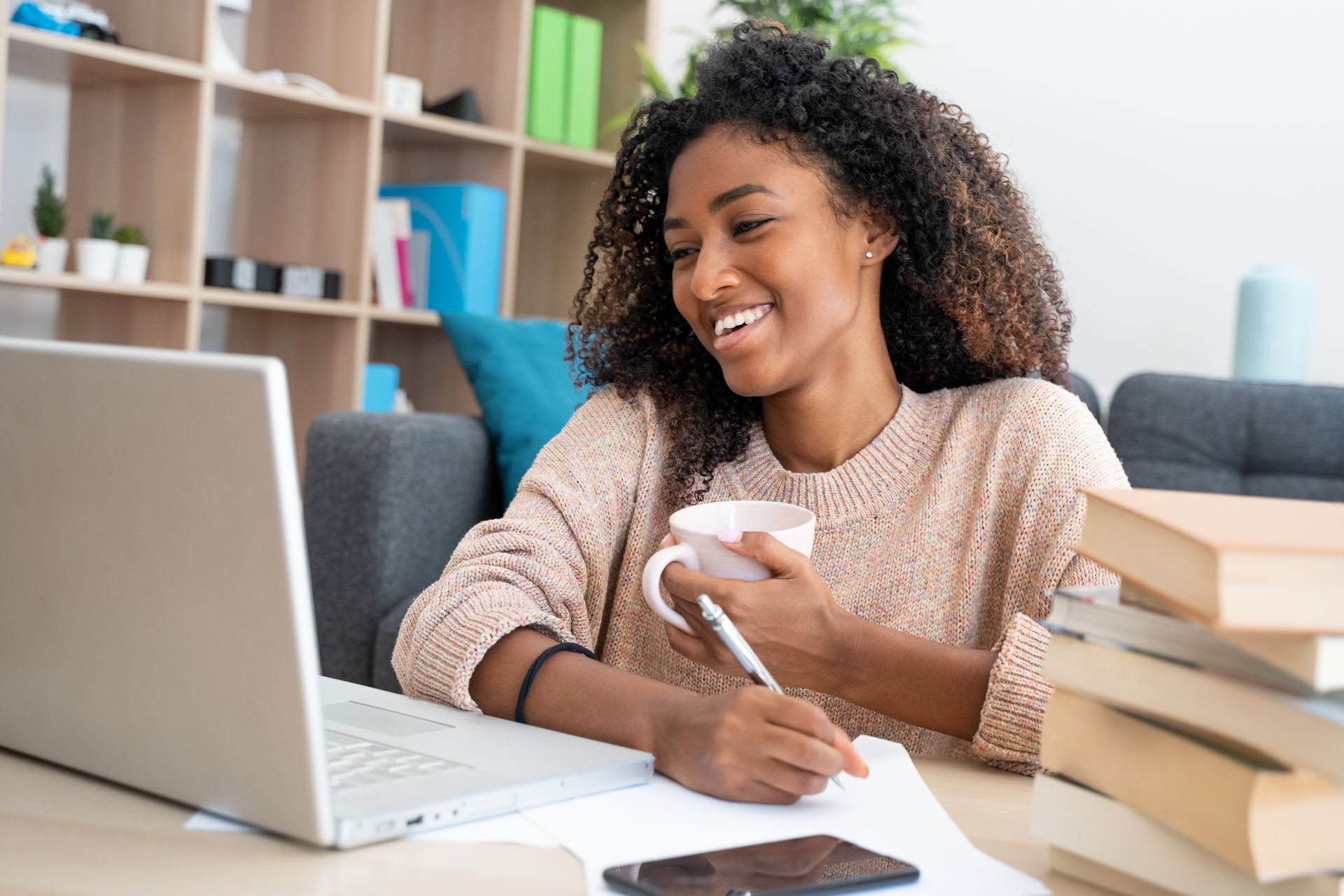 female student studying using a laptop