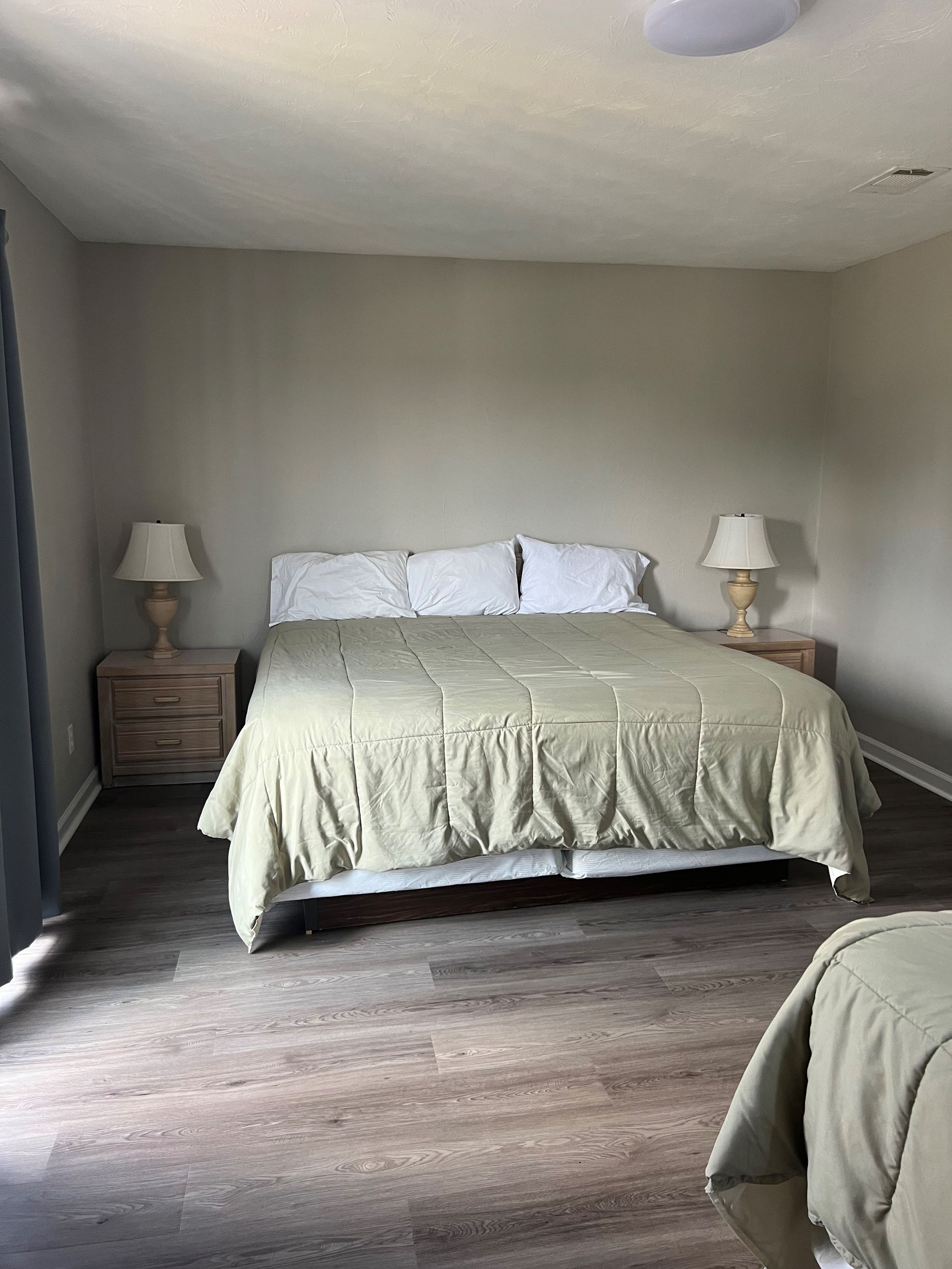 There is a large bed in the middle of the room.