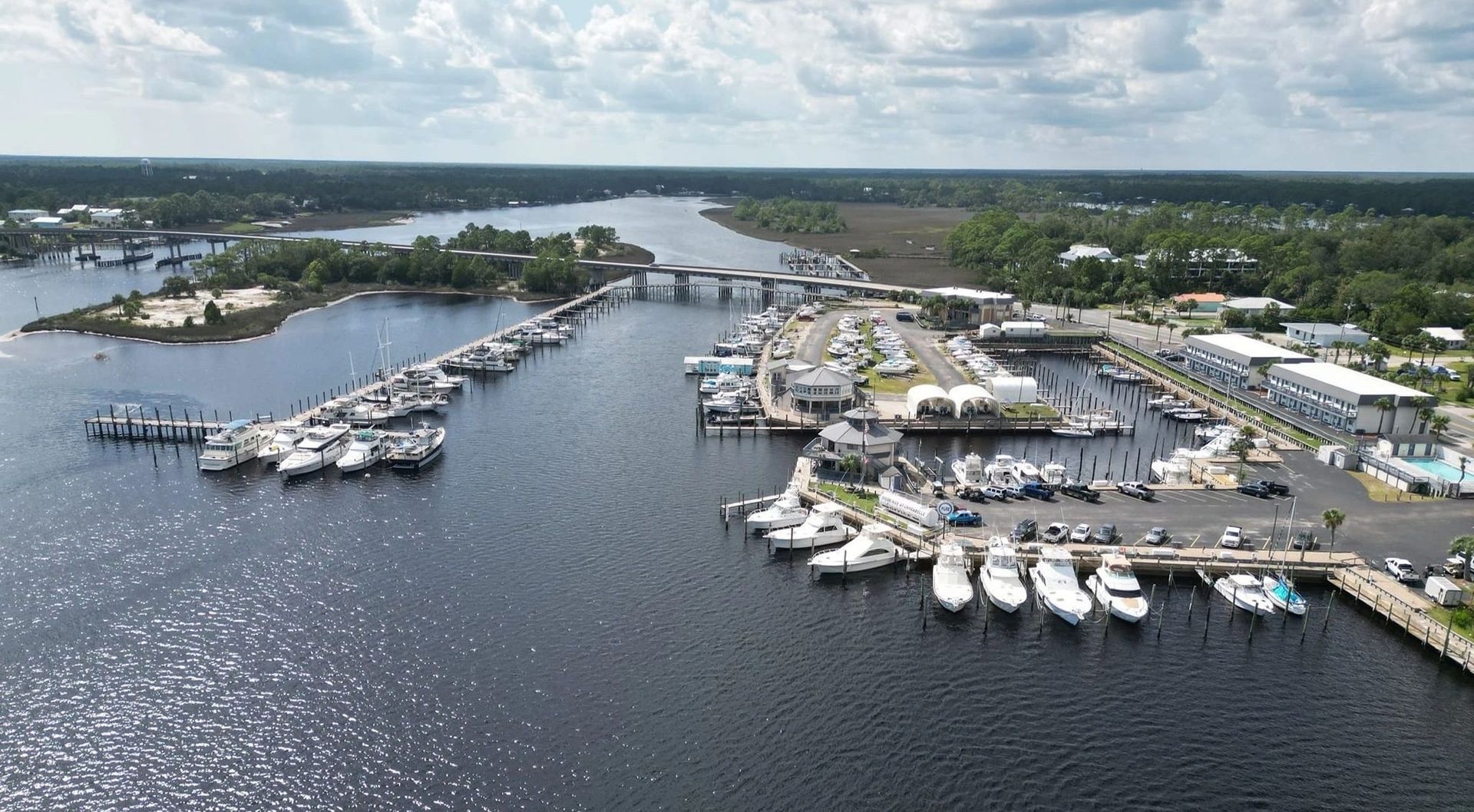 An aerial view of a marina with boats docked in it
