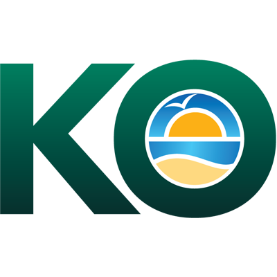 Green and blue KO logo with a stylized sun and wave beneath it