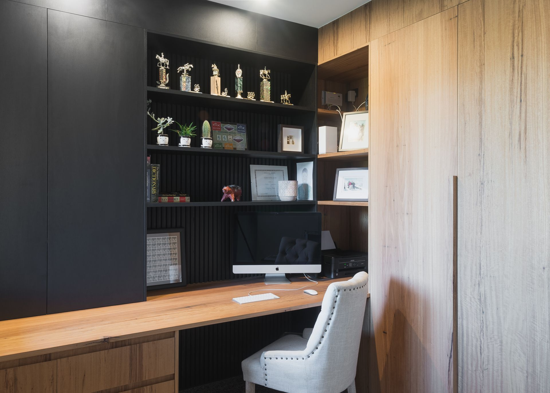Black Closet Doors With Vertical Copper-colored Handles in a Room — Akyrah Kitchens in Gympie, QLD
