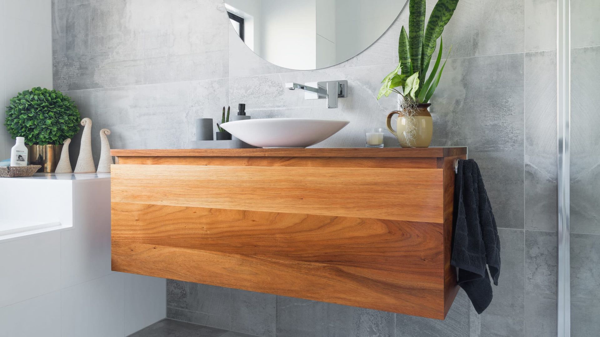 Wooden Floating Vanity With a White Vessel Sink in a Modern Bathroom — Akyrah Kitchens in Gympie, QLD