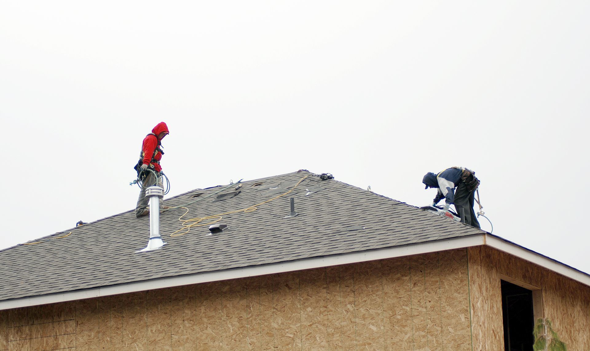 Local roofers installing a FORTIFIED-rated storm-resistant roof.