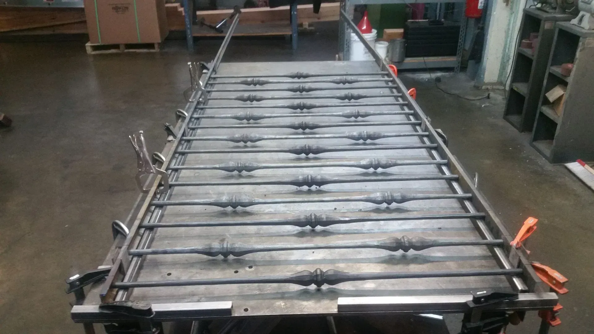 Industrial conveyor line with metal rollers in a workshop, viewed from above