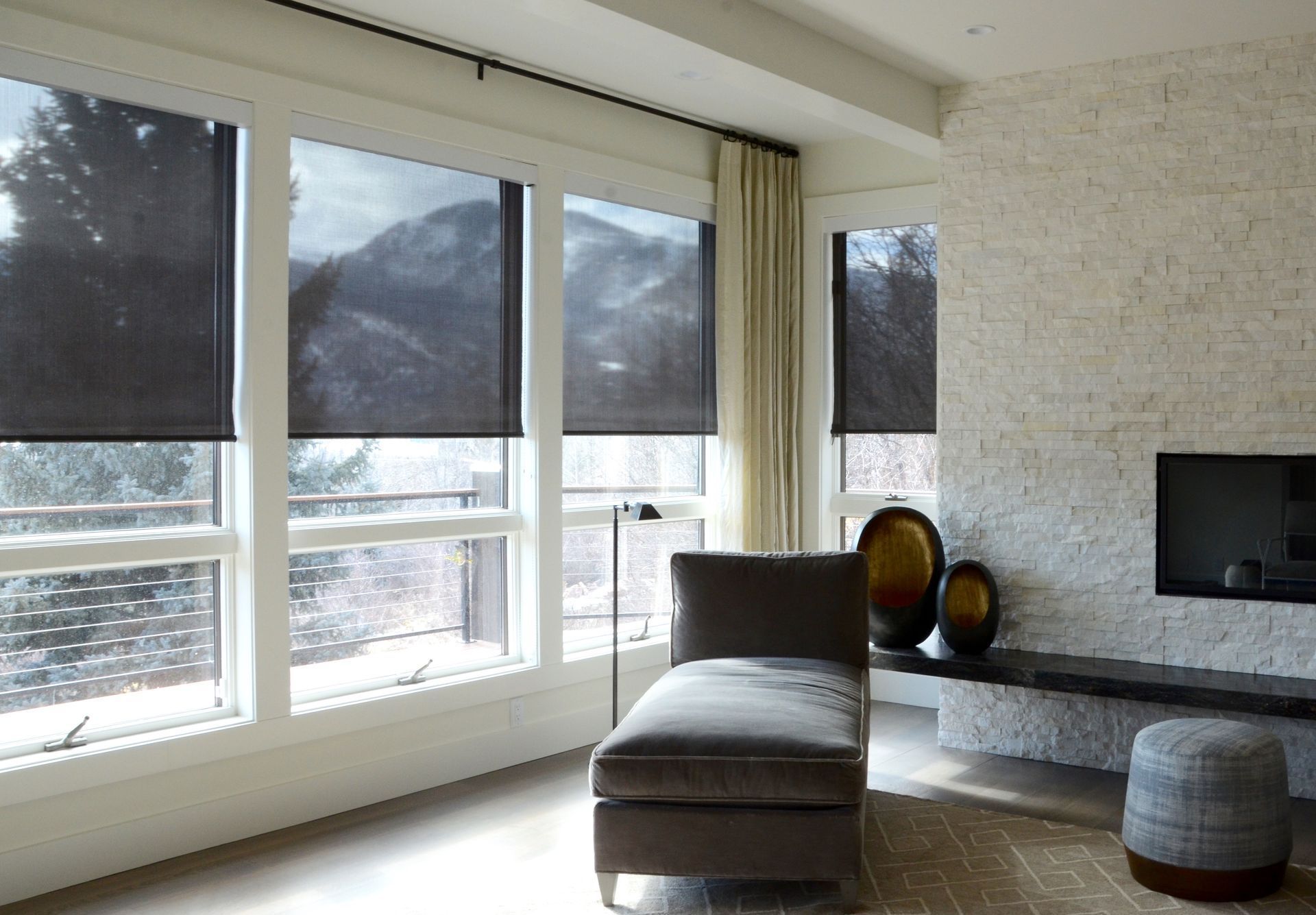Motorized shades and custom drapery in mountain view living room