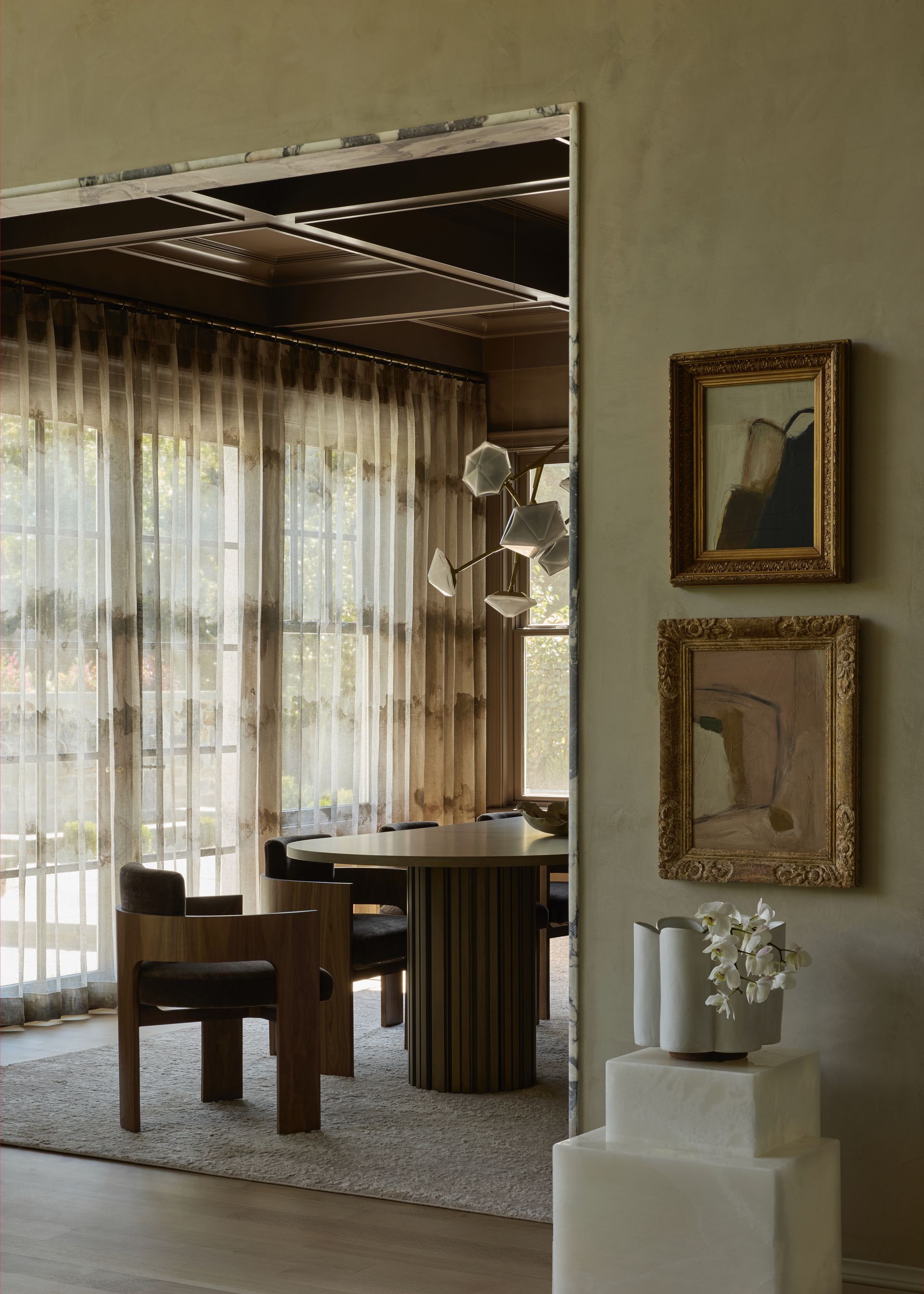 Custom sheer drapery creating soft natural light in luxury interior