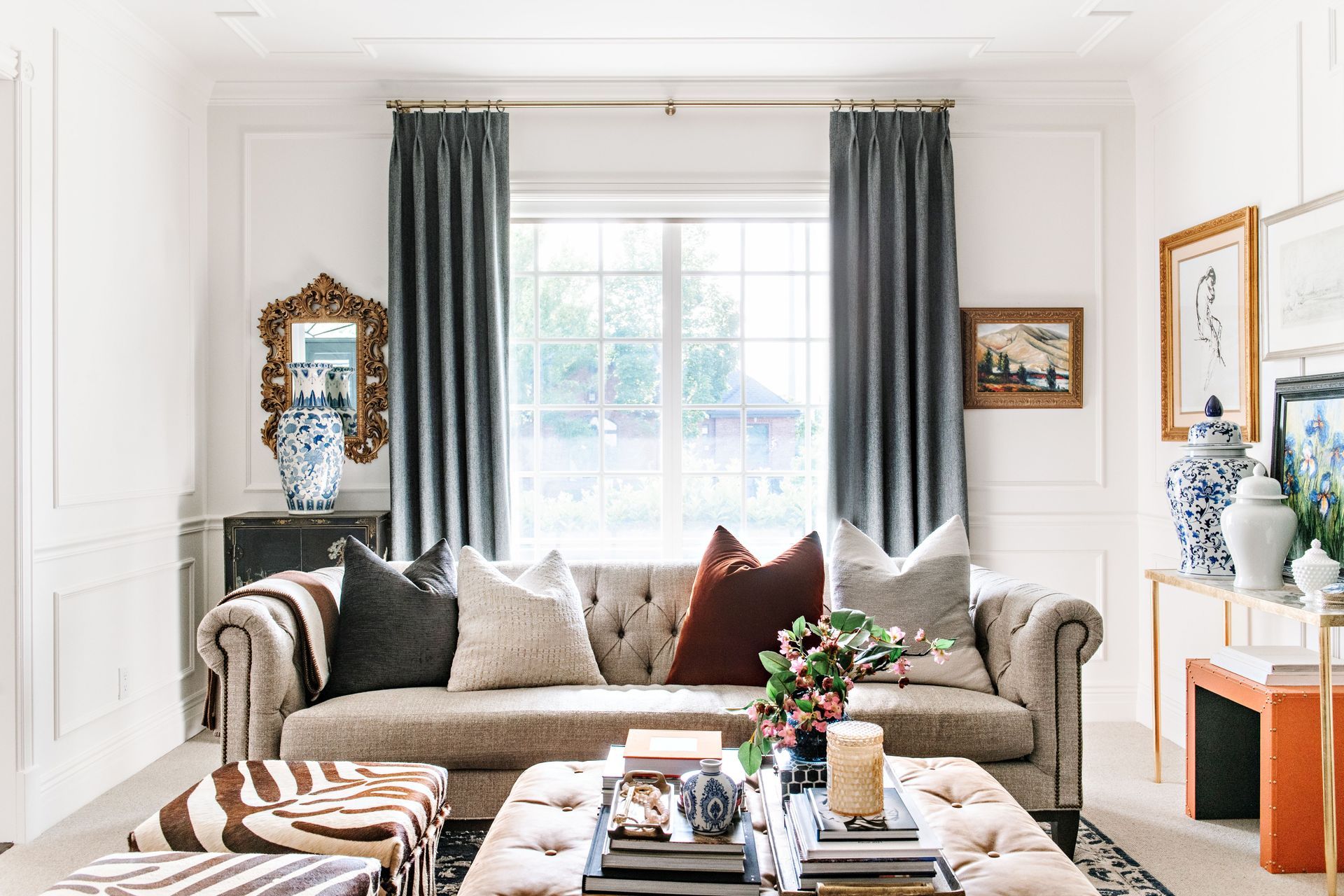 Custom drapery framing windows in elegant traditional living room