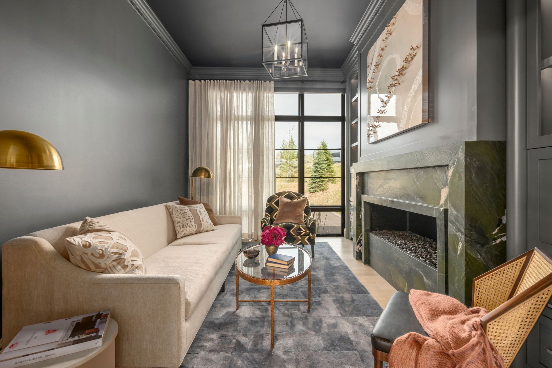 Custom drapery and layered window treatments in sophisticated sitting room