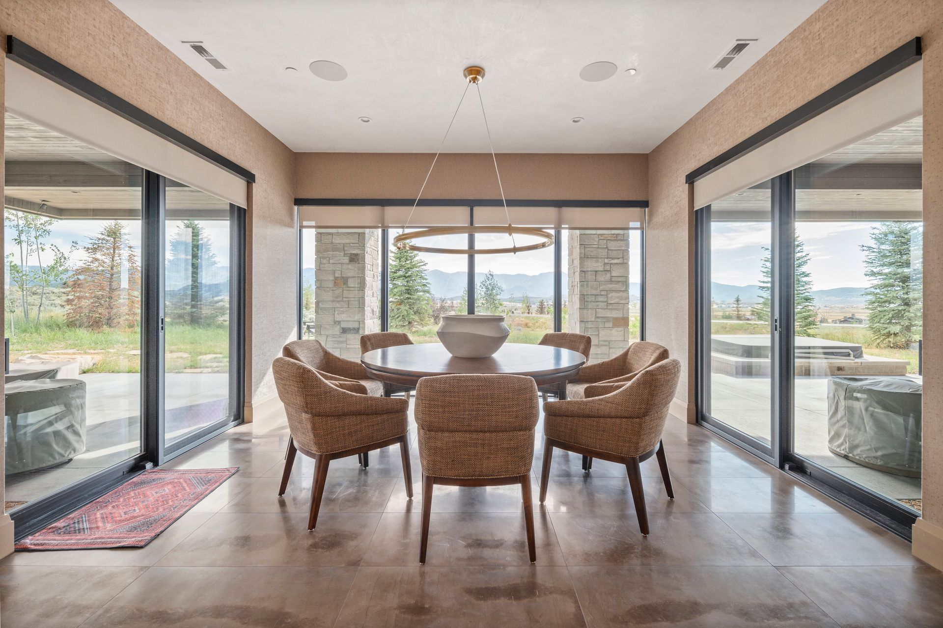 Custom shades and drapery in dining room with panoramic views