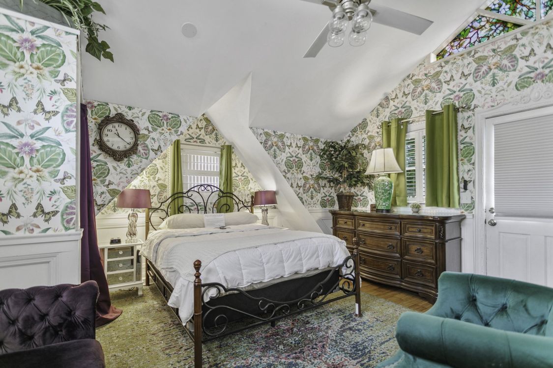 Bed in a bedroom with dresser