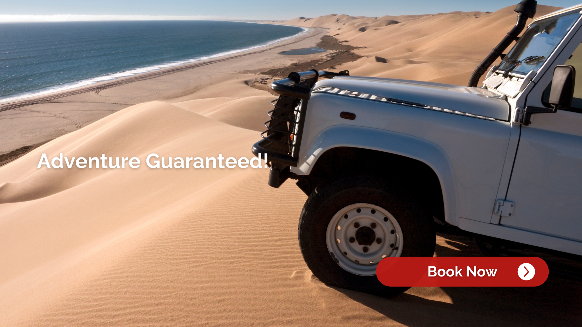 White off-road vehicle on a sand dune near the ocean; adventure guaranteed.