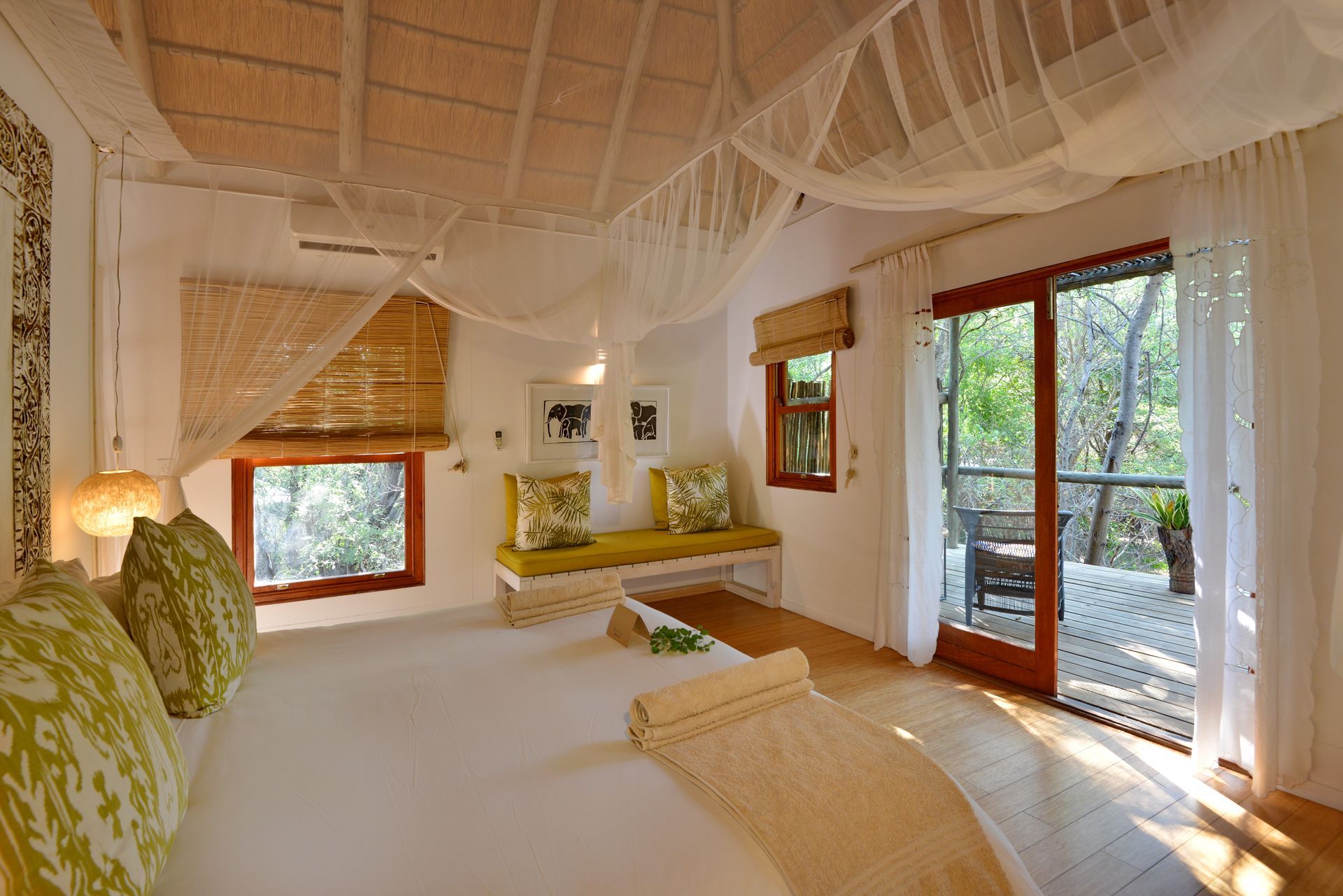 A bedroom with a bed and a sliding glass door
