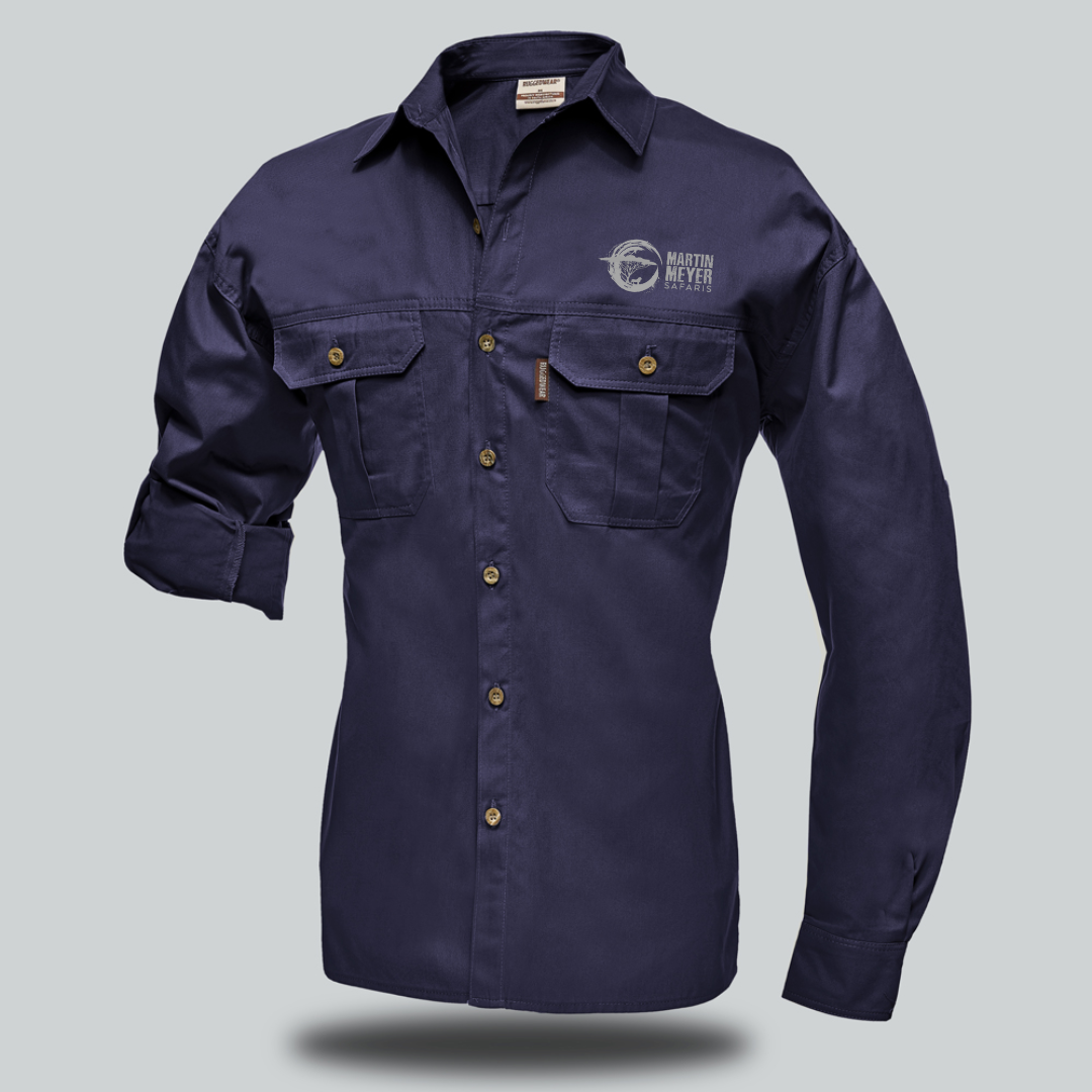 Olive-green long-sleeved button-up shirt with two chest pockets, logo on left chest, rolled-up sleeve.