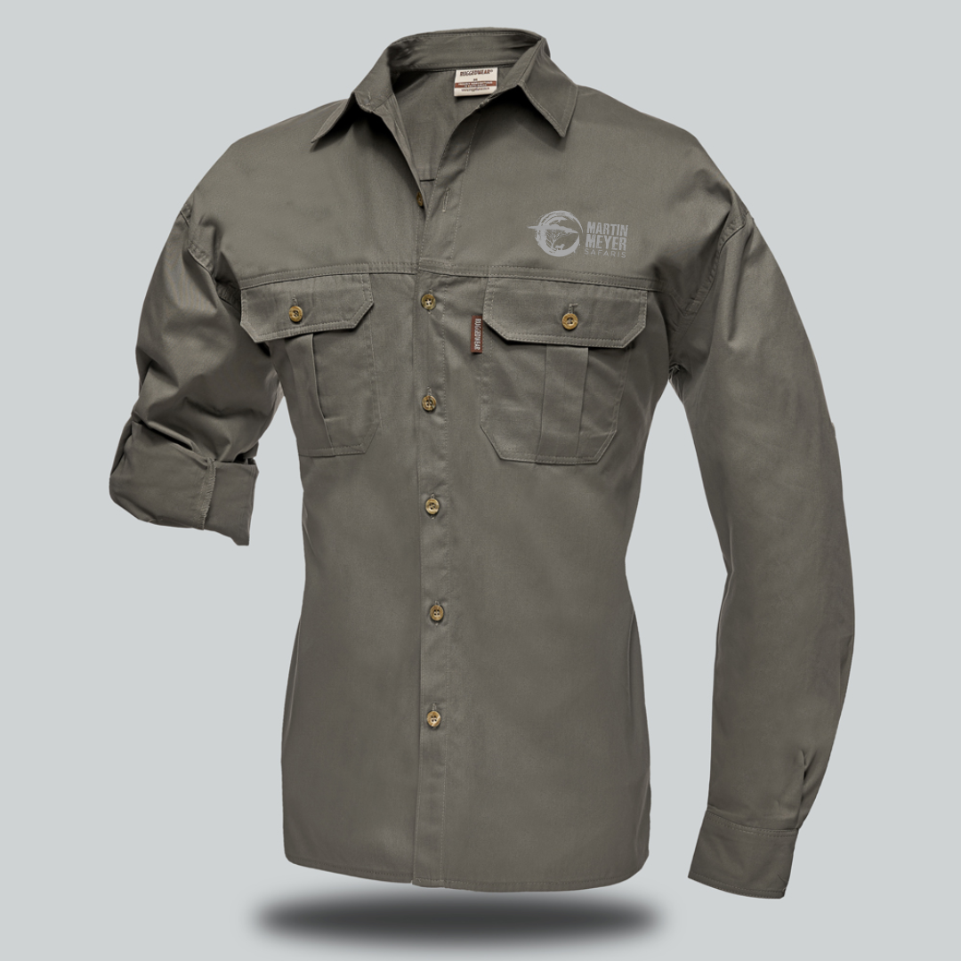 Olive-green long-sleeved button-up shirt with two chest pockets, logo on left chest, rolled-up sleeve.