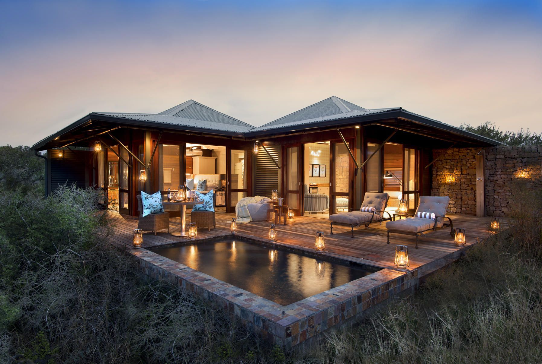 A house with a swimming pool in front of it Malaria Free Safari Destinations