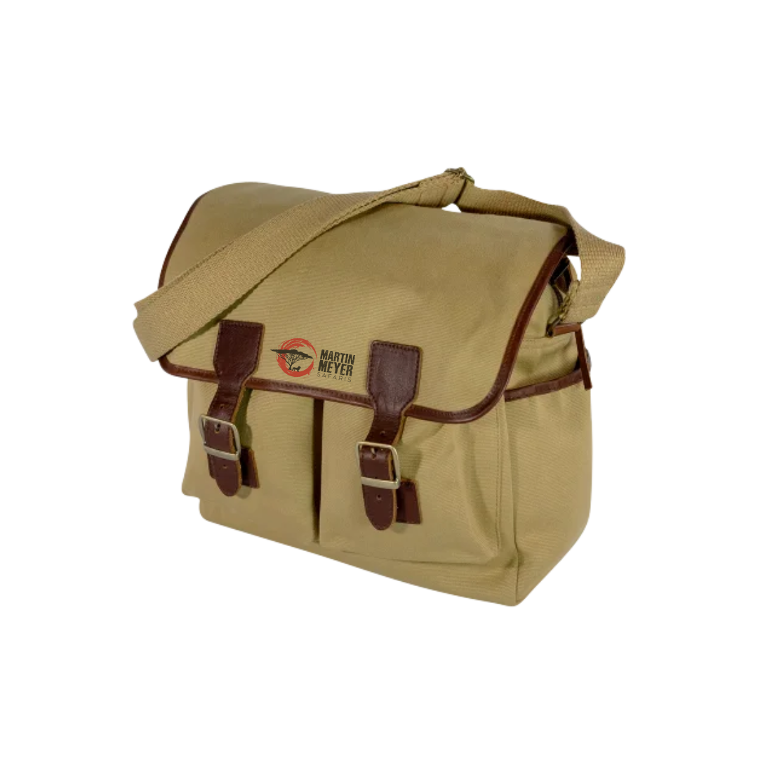 Tan messenger bag with brown leather trim, buckles, and shoulder strap; Red Kite logo.