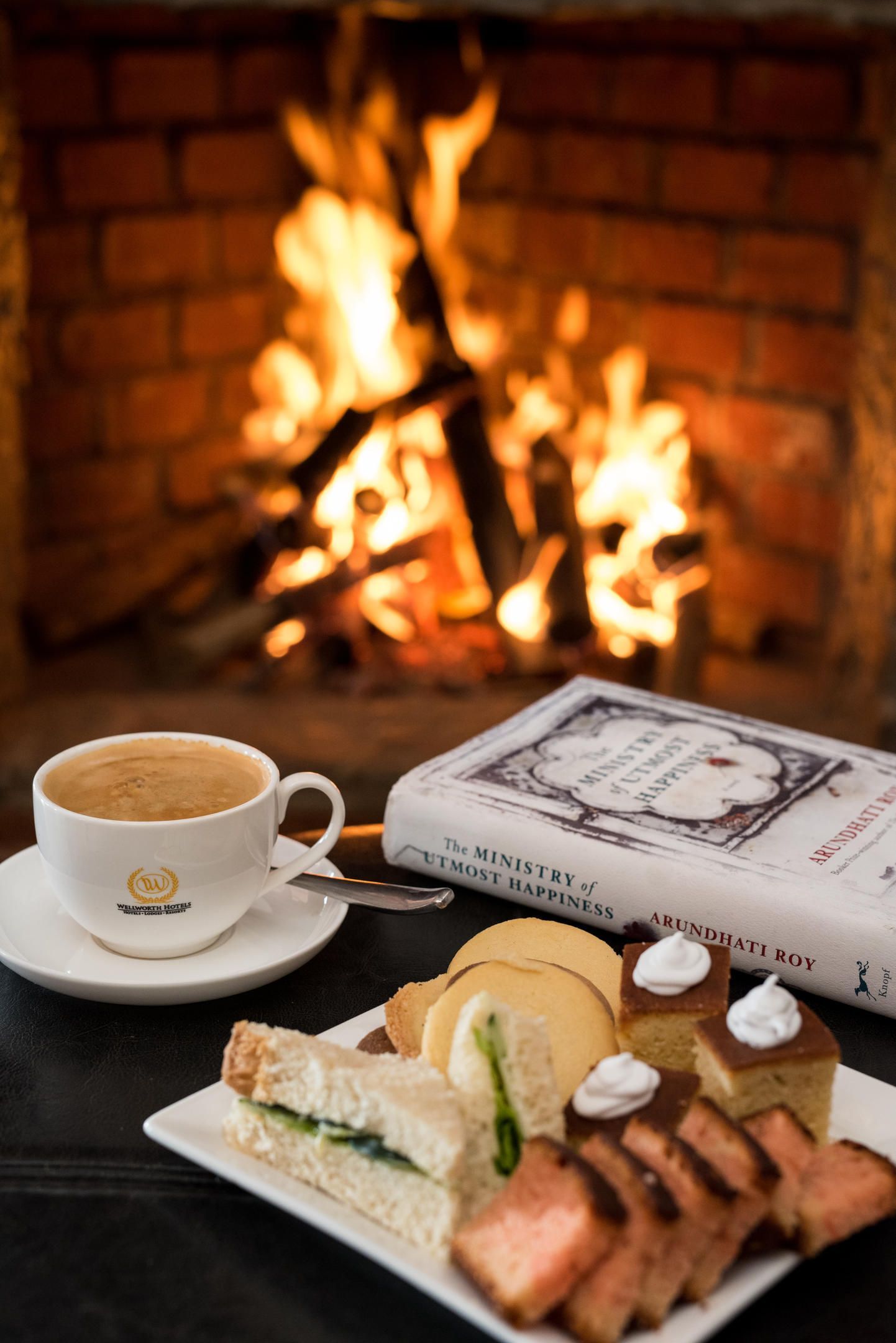 A plate of food and a cup of coffee in front of a fireplace Ngorongoro Crater